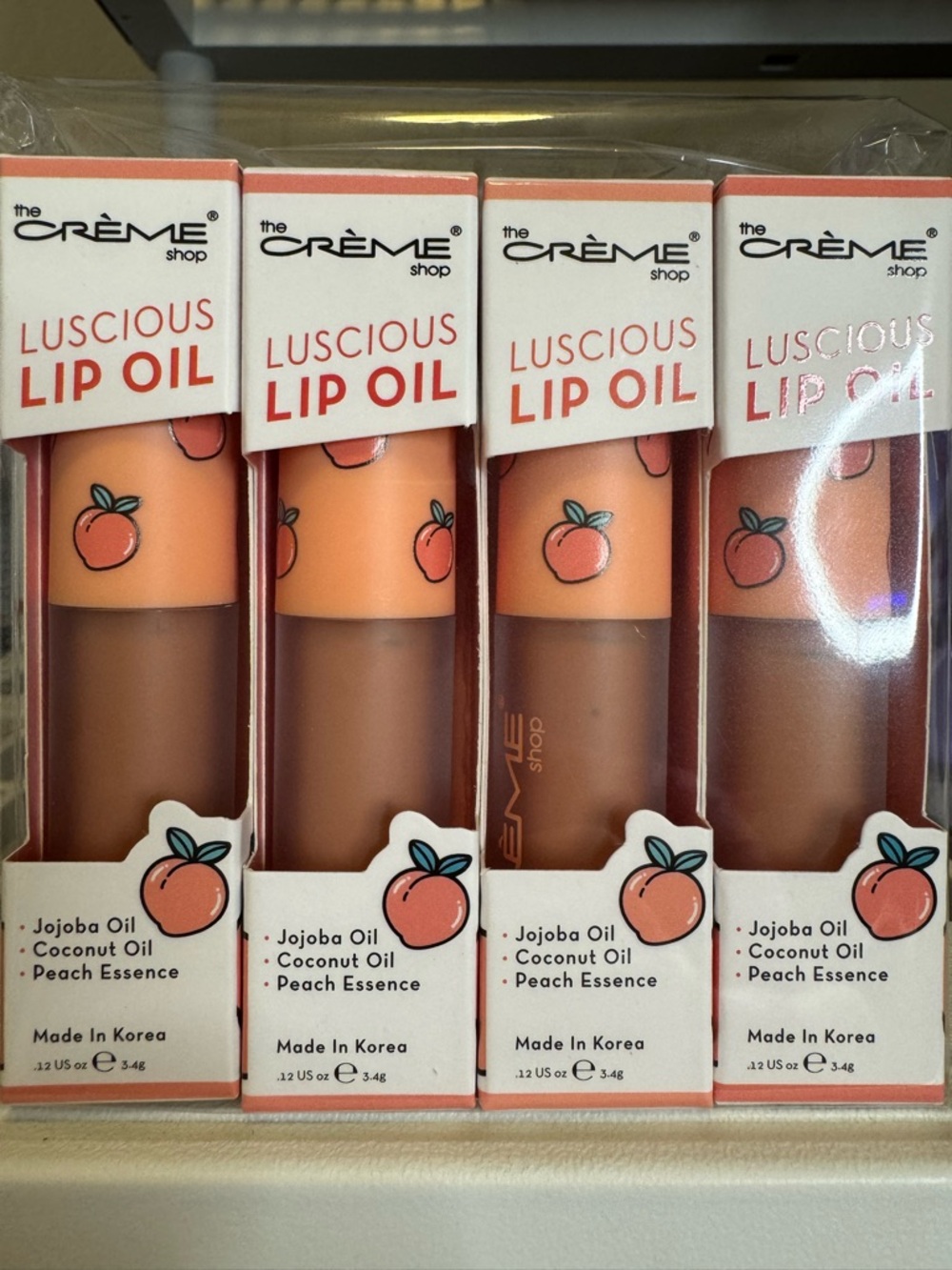 (4) The Crème Shop Luscious Lip Oil in Peach